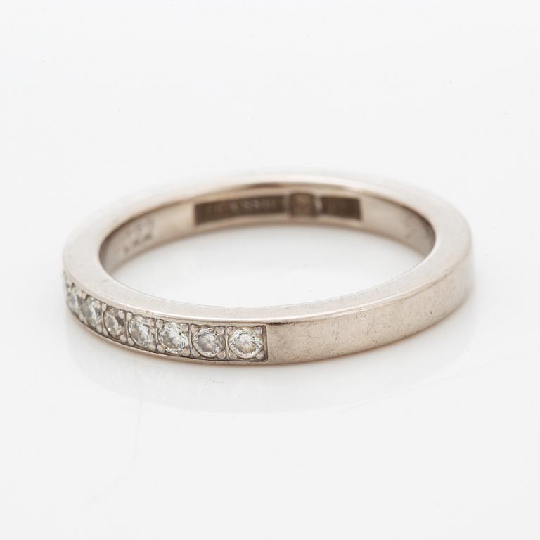 Brilliant-cut diamond half eternity ring.