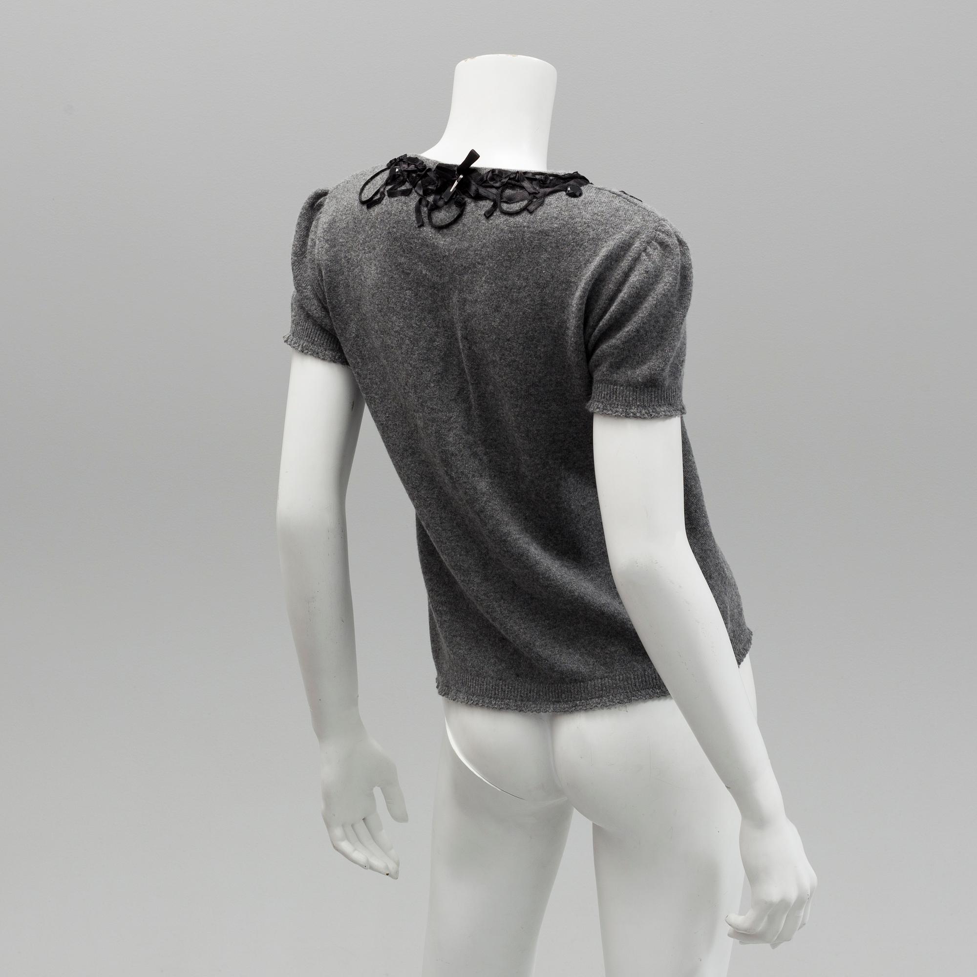 Cardigan and top by Moschino, Cheap and Chic.