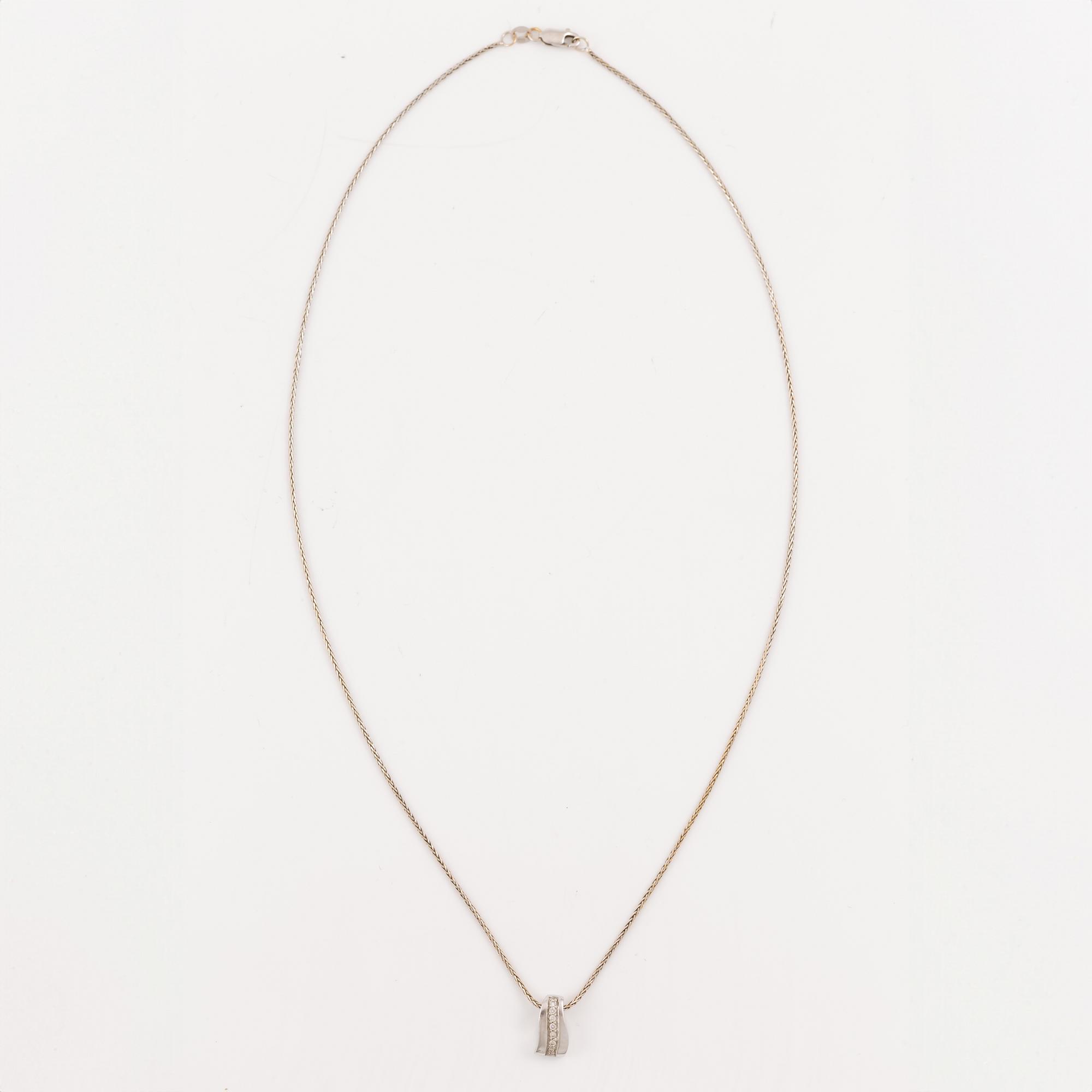 Pendant with chain, 18K white gold set with brilliant-cut diamonds.
