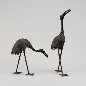 A pair of Chinese metal cranes, first half of the 20th century.