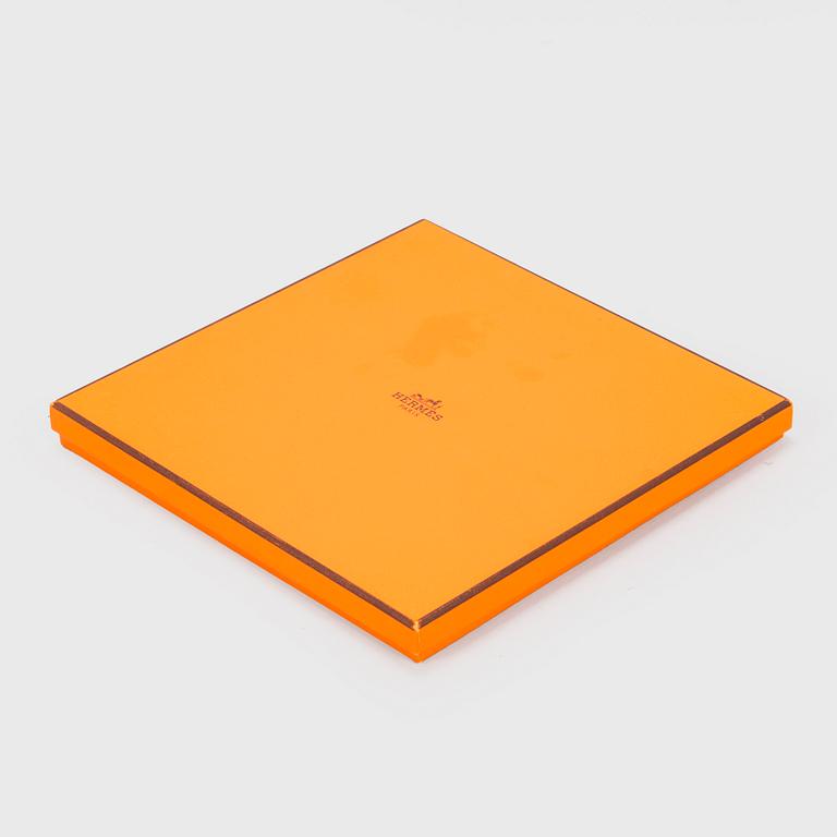Hermès, a 'Les Voitures à Transformation' silk scarf.