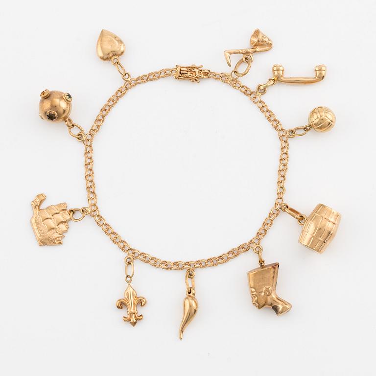 Bracelet, 18K gold with charms.