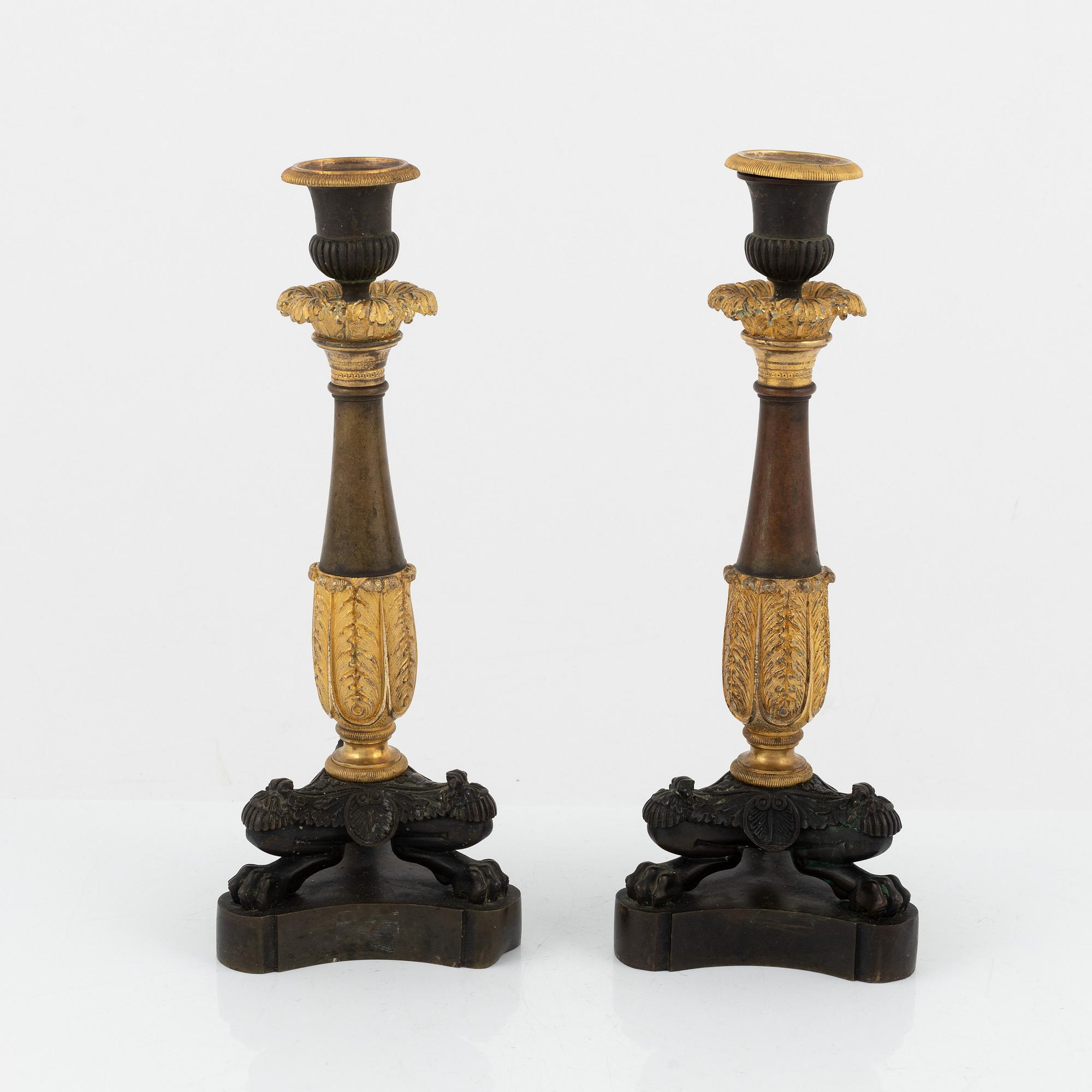 A pair of 19th century empire-style bronze candlesticks.