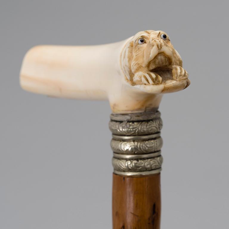 A WALKING STICK, bone and wood, late 19th century.