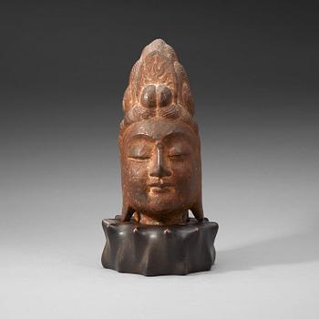 80. A Chinese stone head of Guanyin, possibly Tangdynasty.