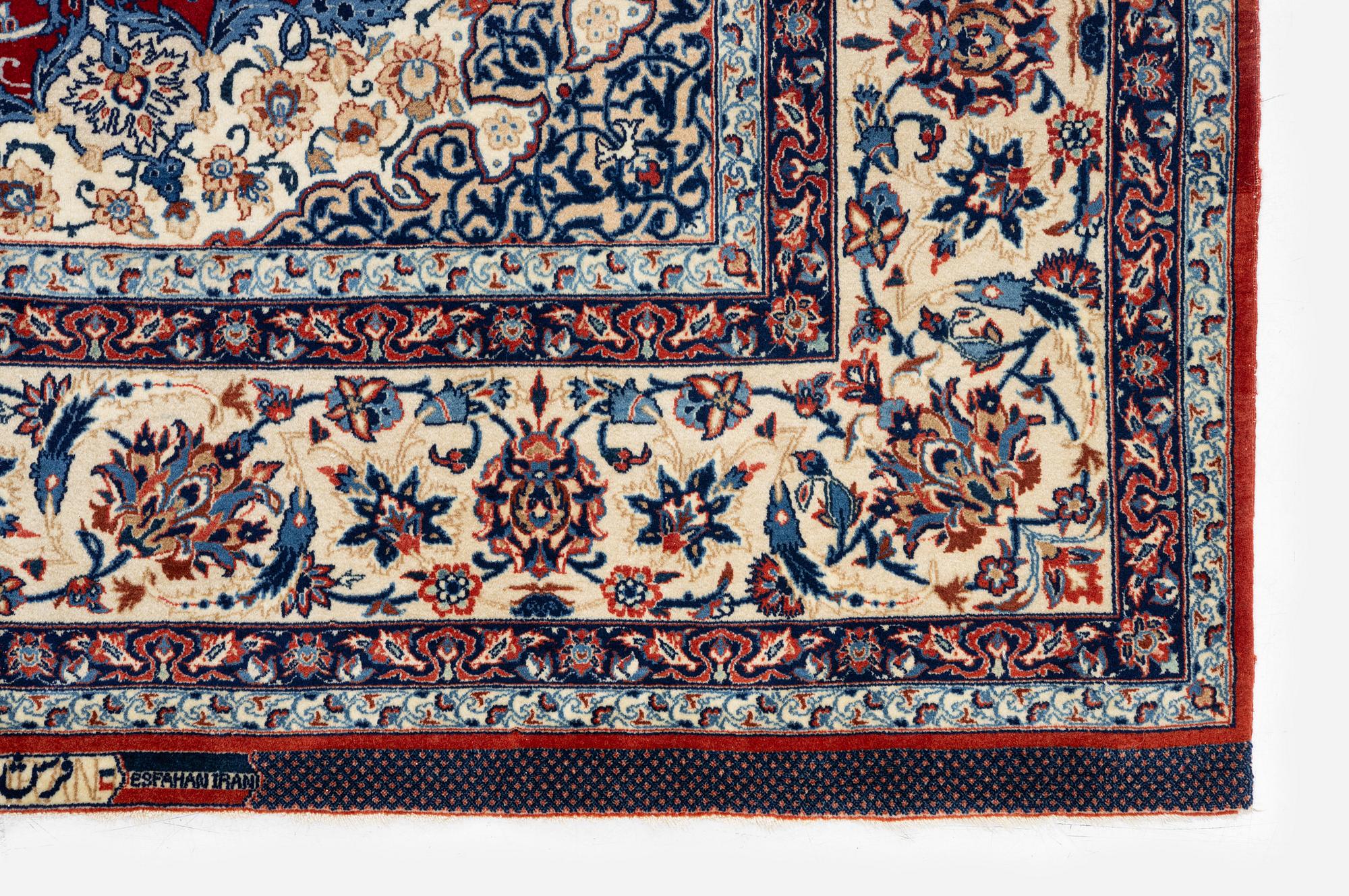 A semi-antique Isfahan rug, Central Persia, signed (Sadegh) Seirafian, c. 237 x 146 cm.