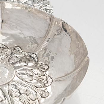 A 20th-century silver dish with a 3 shilling coin dated 1813.