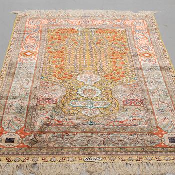 A CARPET, Oriental silk souf (relief), probably Chinese ca 184,5 x 124 cm.