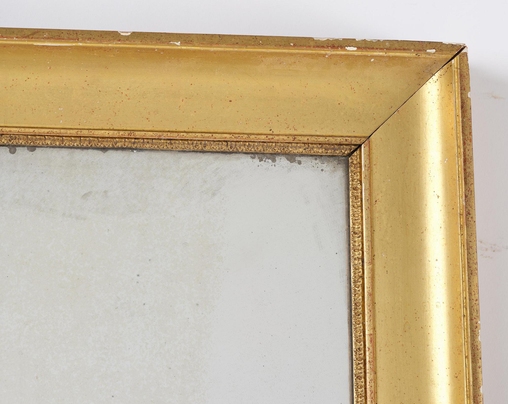 A Swedish giltwood Empire mirror, first part 19th century.