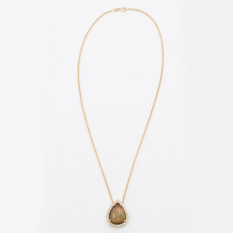 Necklace in 18K gold with a drop-shaped opal and octagon-cut diamonds.