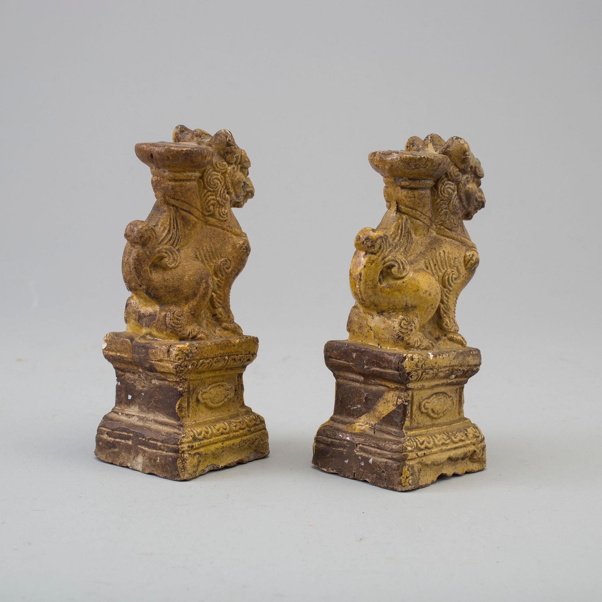 A pair of yellow glazed chinese joss sticks holders, 17th Century.