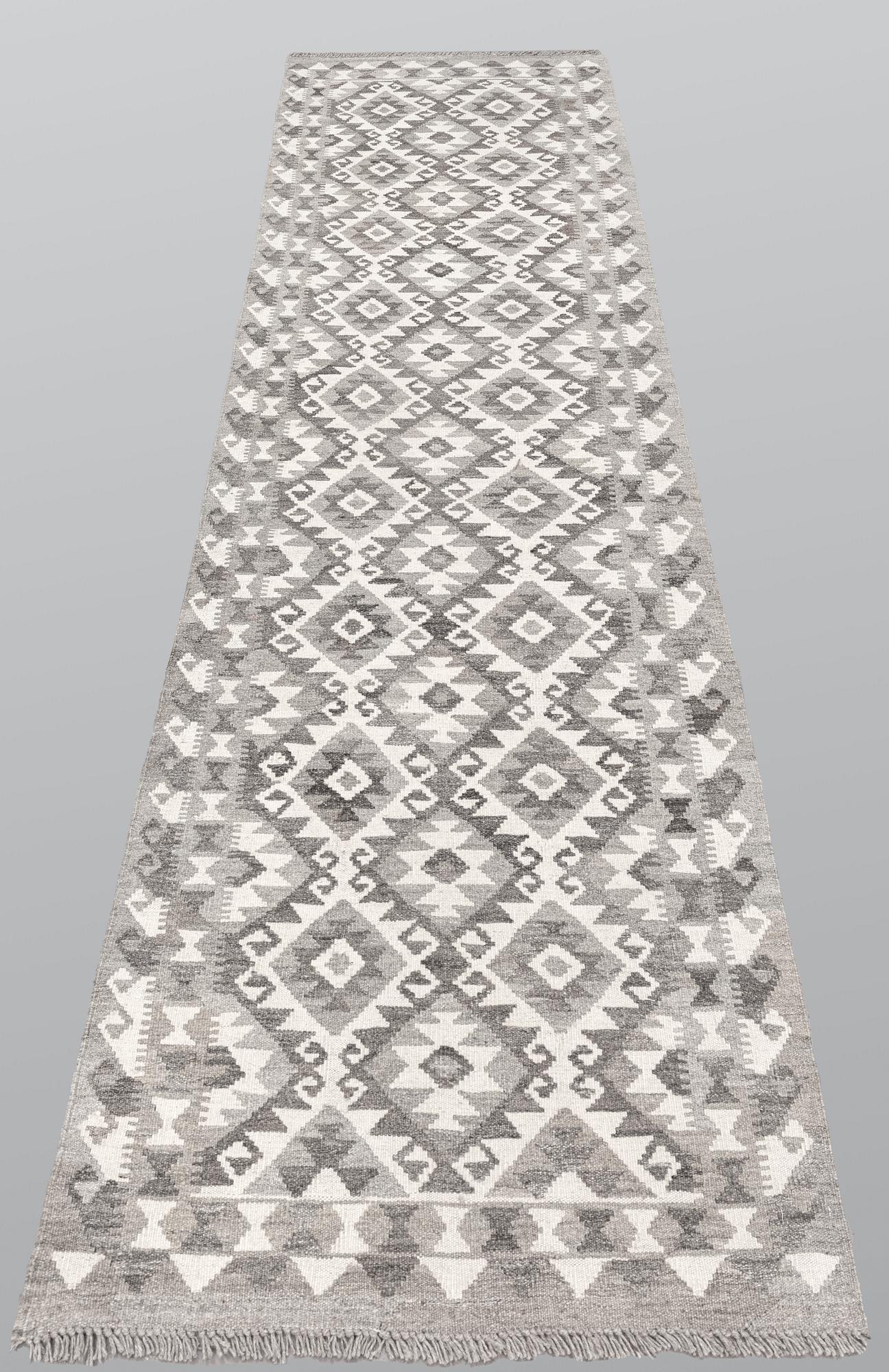 A runner, kilim, ca 298 x 84 cm.