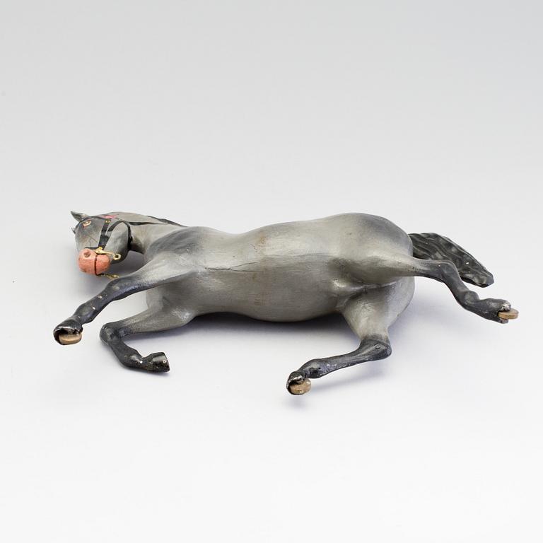 A painted tinplate toy horse ca year 1900.