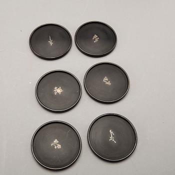 A Swedish 20th century set of 14 plates in bakelite and silver mark of T Wendt Helsingborg 1945.