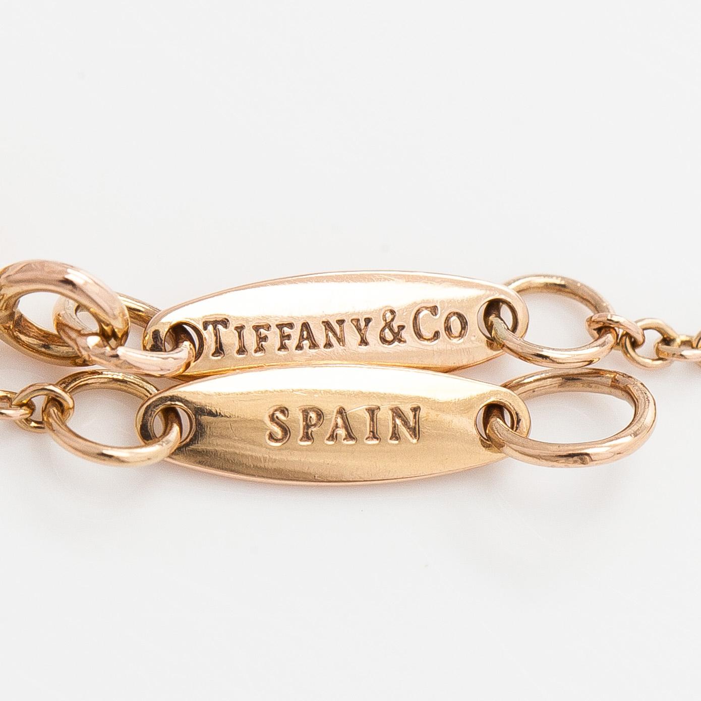 Tiffany & Co, an 18K gold 'Diamonds by the Yard' bracelet with a brilliant-cut diamond.