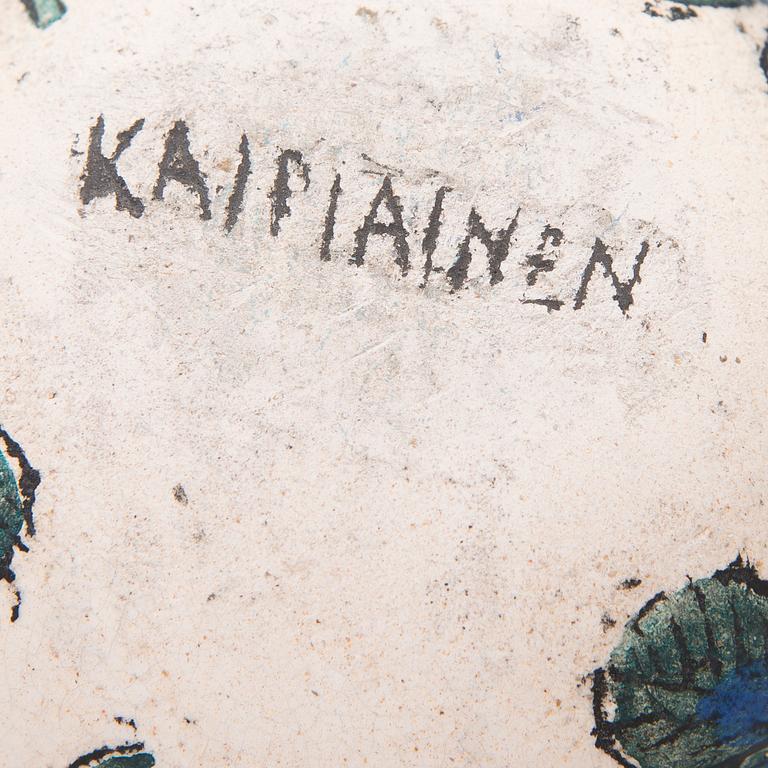 A ceramic bird signed Kaipiainen.