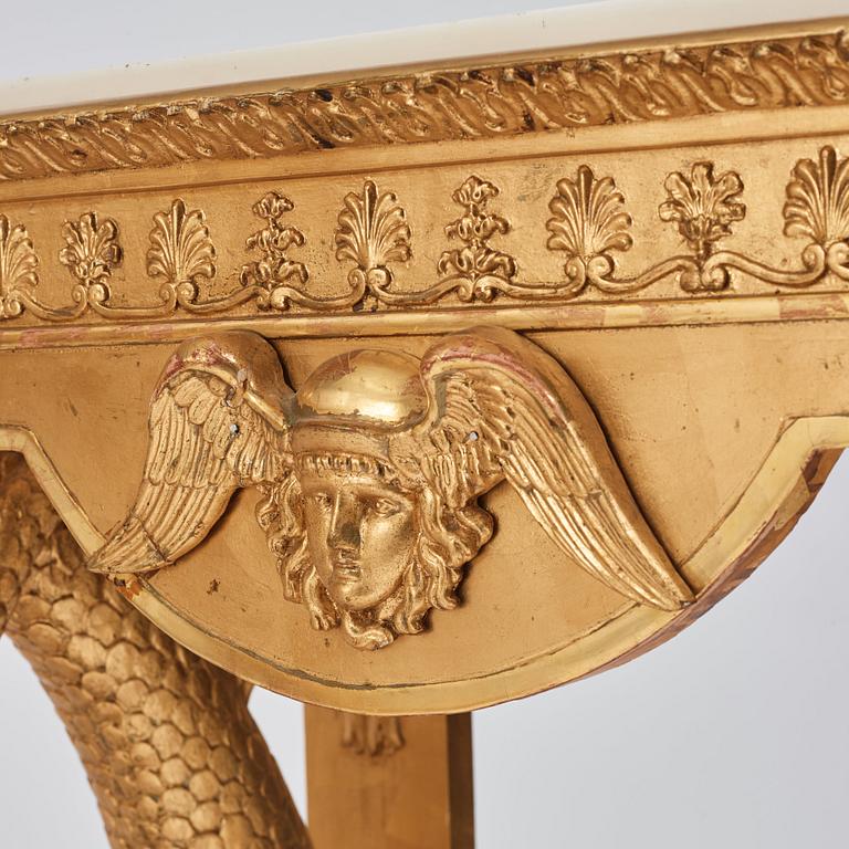 A pair of Swedish Empire carved and giltwood console tables, first half of the 19th century.