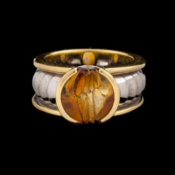 An 'On track' ring by Jan Jörgensen for Georg Jensen set with a fantasy cut citrine, ca 1980's.