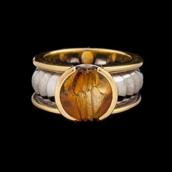 An 'On track' ring by Jan Jörgensen for Georg Jensen set with a fantasy cut citrine, ca 1980's.