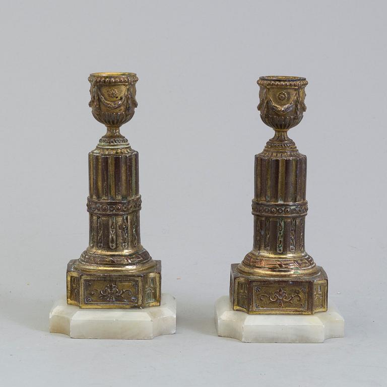 A PAIR OF BRASS AND ALABASTER GUSTAVIAN STYLE CANDLESTICKS, 19th century.