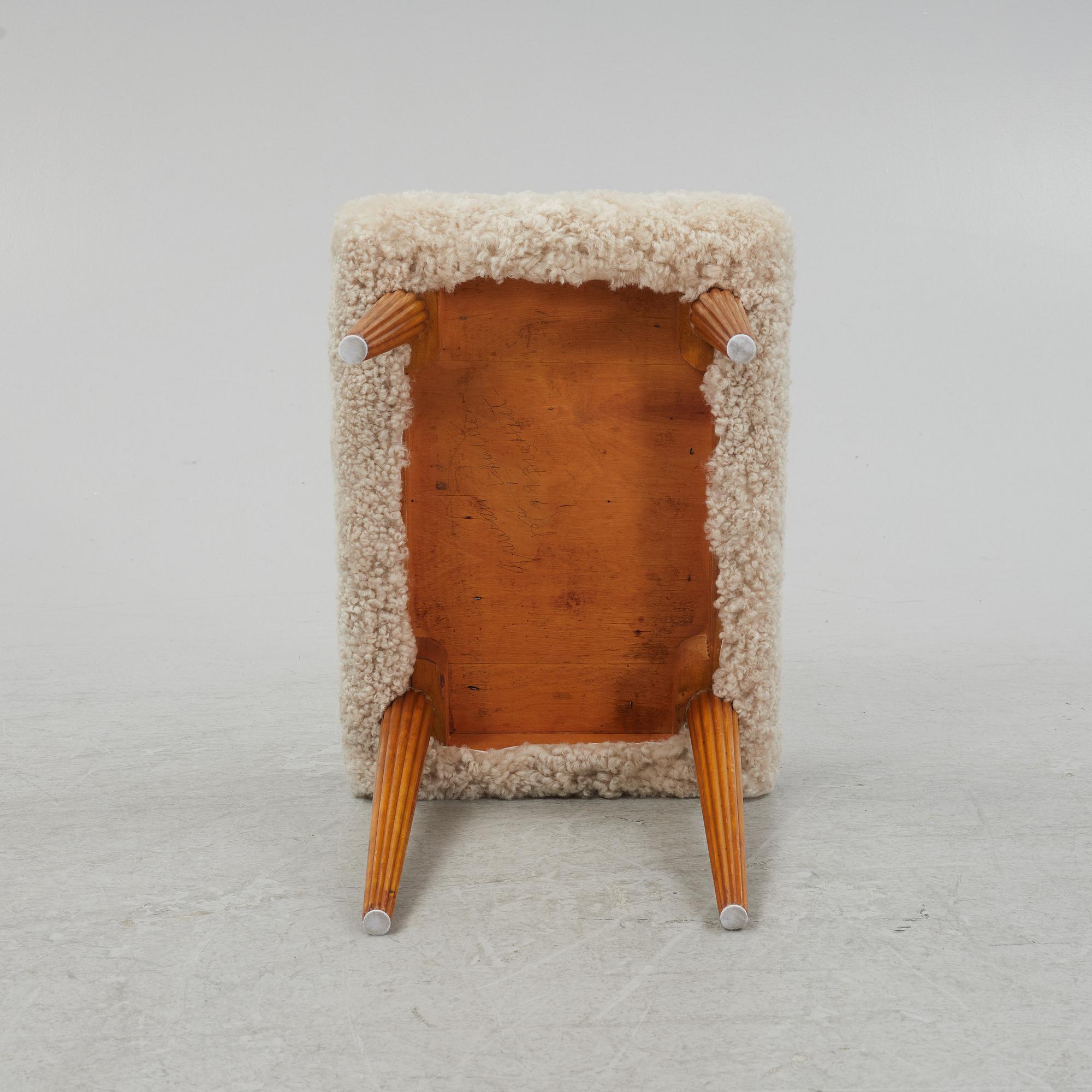 A sheepskin upholstered stool, mid 20th Century.