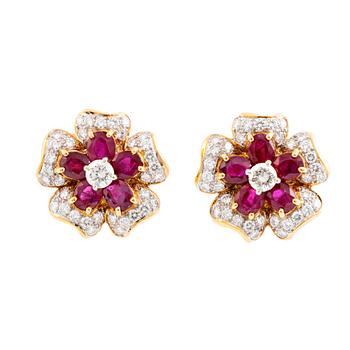 18K gold, ruby and brilliant cut diamond flower earrings.