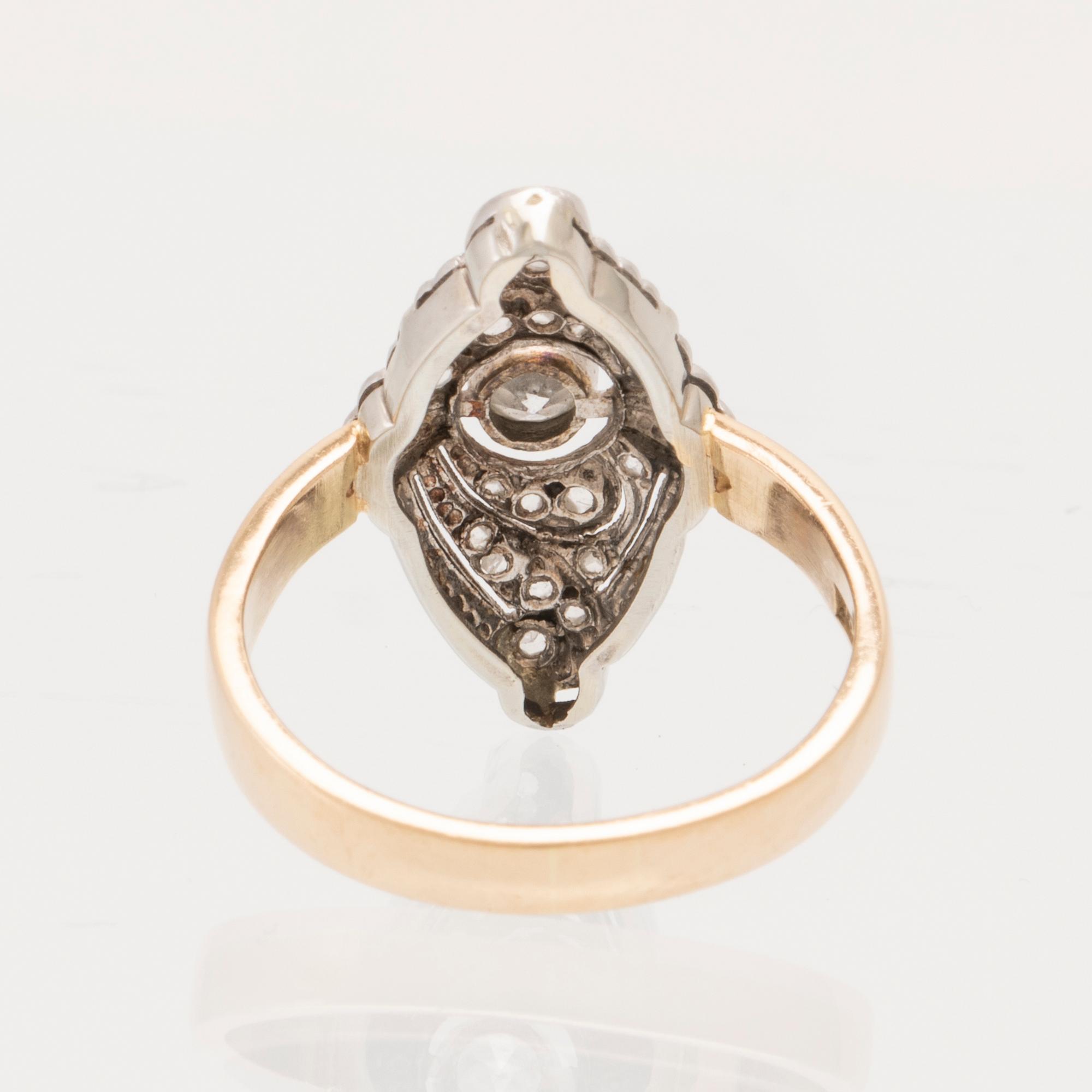 An Art Deco ring in 18K white and red gold set with rose-cut and old-cut diamonds.