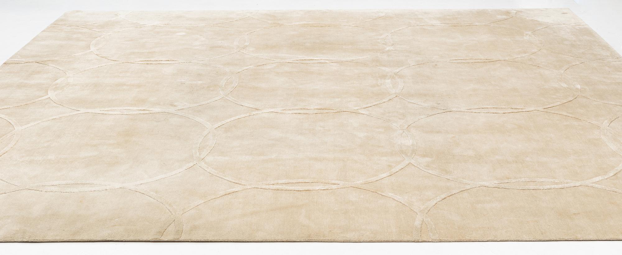 A carpet 360 x 360 cm.
