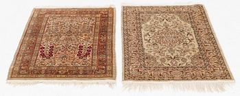 Two Silk Hereke Rugs, circa 87 x 60 and circa 90 x 60 cm.