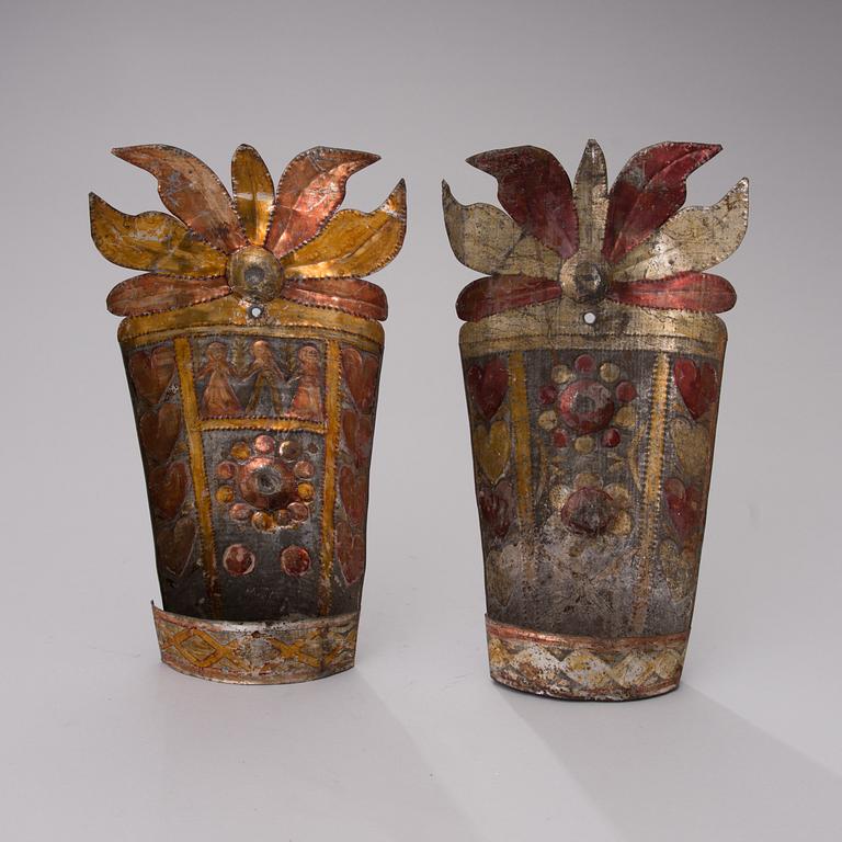 A pair of late 19th century tin wall sconces.