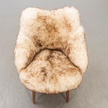 A 1950/60 sheepskin armchair.