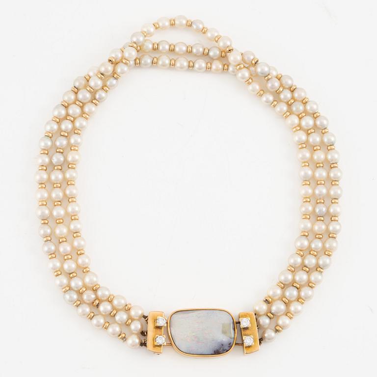 Necklace, three strands, cultured pearls clasp 14K gold with opal and round brilliant-cut diamonds.