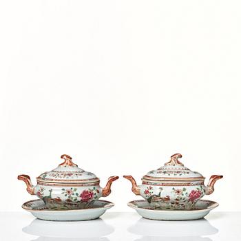 Two famille rose 'double peacock' butter tureens with covers and stands, Qing dynasty, Qianlong (1736-95).