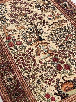 A CARPET, a semi-antique Esfahan figural, 215,5 x 140,5 cm.