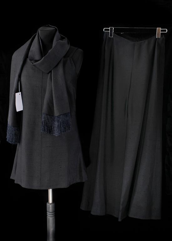 A black three-piece 1960s/70s ensemble consisting of trousers, top and scarf by Christian Dior.