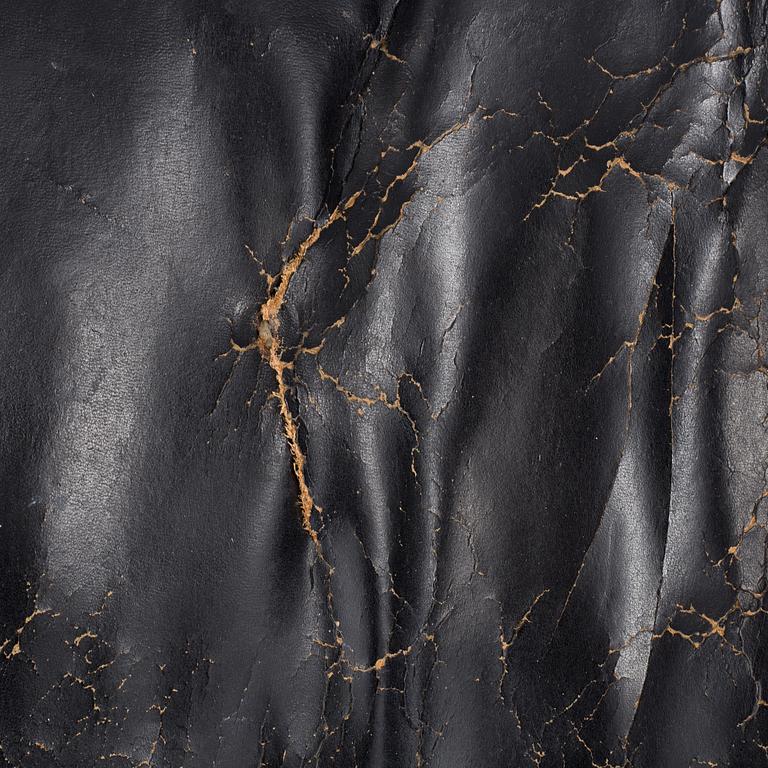 An easy chair and ottoman by Charles & Ray Eames, Herman Miller, USA, produced with licence by Hille, London.