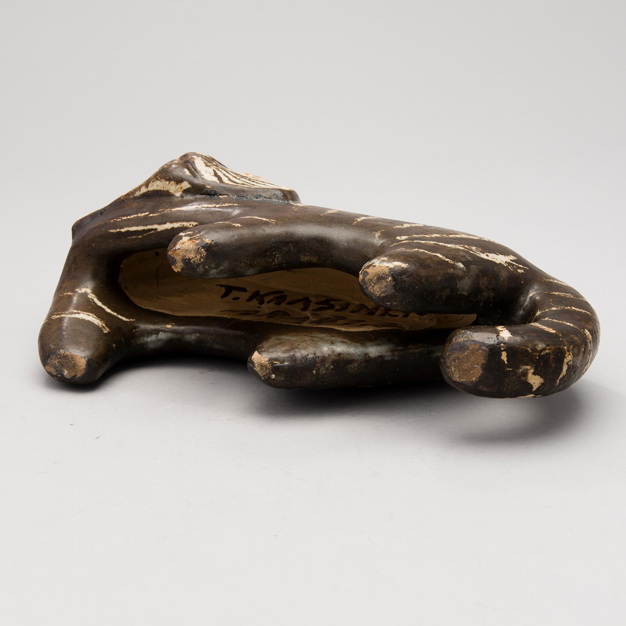 A Ceramic Figurine, signed T Kaasinen Arabia Finland.
