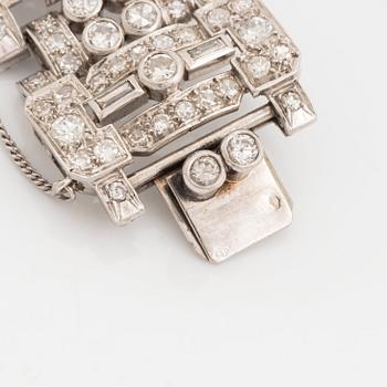 An 18K white gold bracelet set with old-, eight- and baguette-cut diamonds.