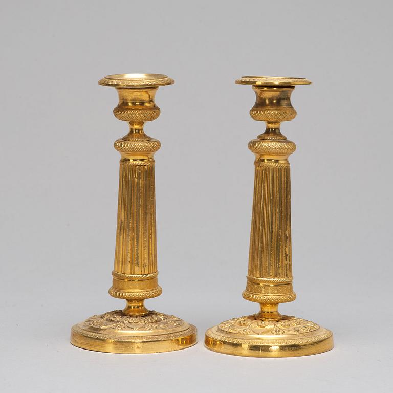 A pair of Empire-style candlesticks, ca 1900.