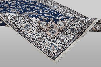A carpet, Nain, part silk, ca 294 x 198 cm.