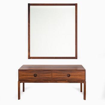 a 1960's mirror with chest of drawer.