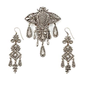 483A. Demi parure, a pair of earrings, and a brooch, with so-called steel diamonds, 19th century.