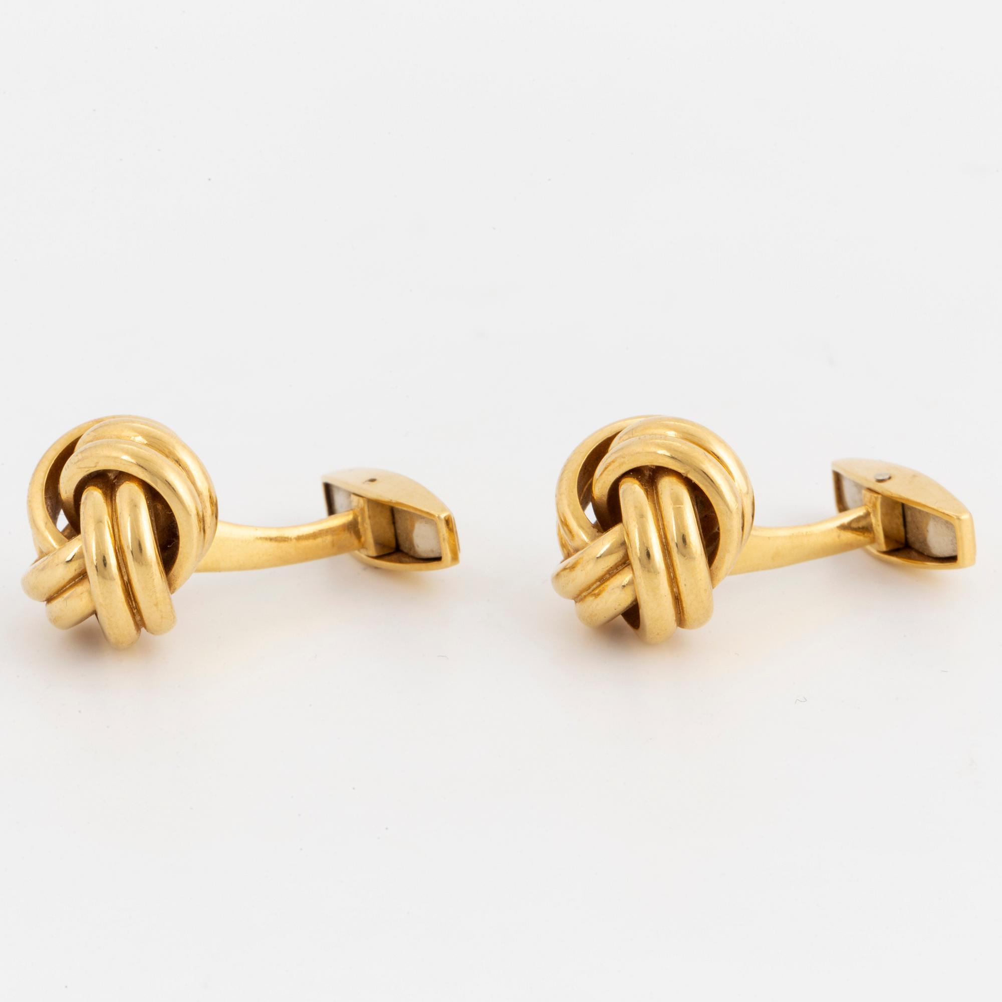 18K gold knot-shaped cufflinks.