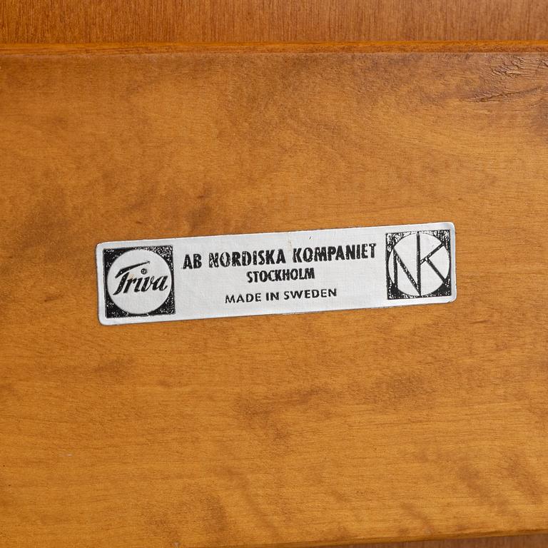 Bengt Ruda, a beech wood  armchair with footstool, with new sheepskin upholstery, for Nordiska Komapniet, 1950s.