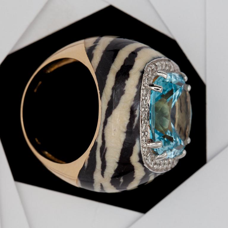 An aquamarine and brilliant cut diamond ring with zebra pattern.