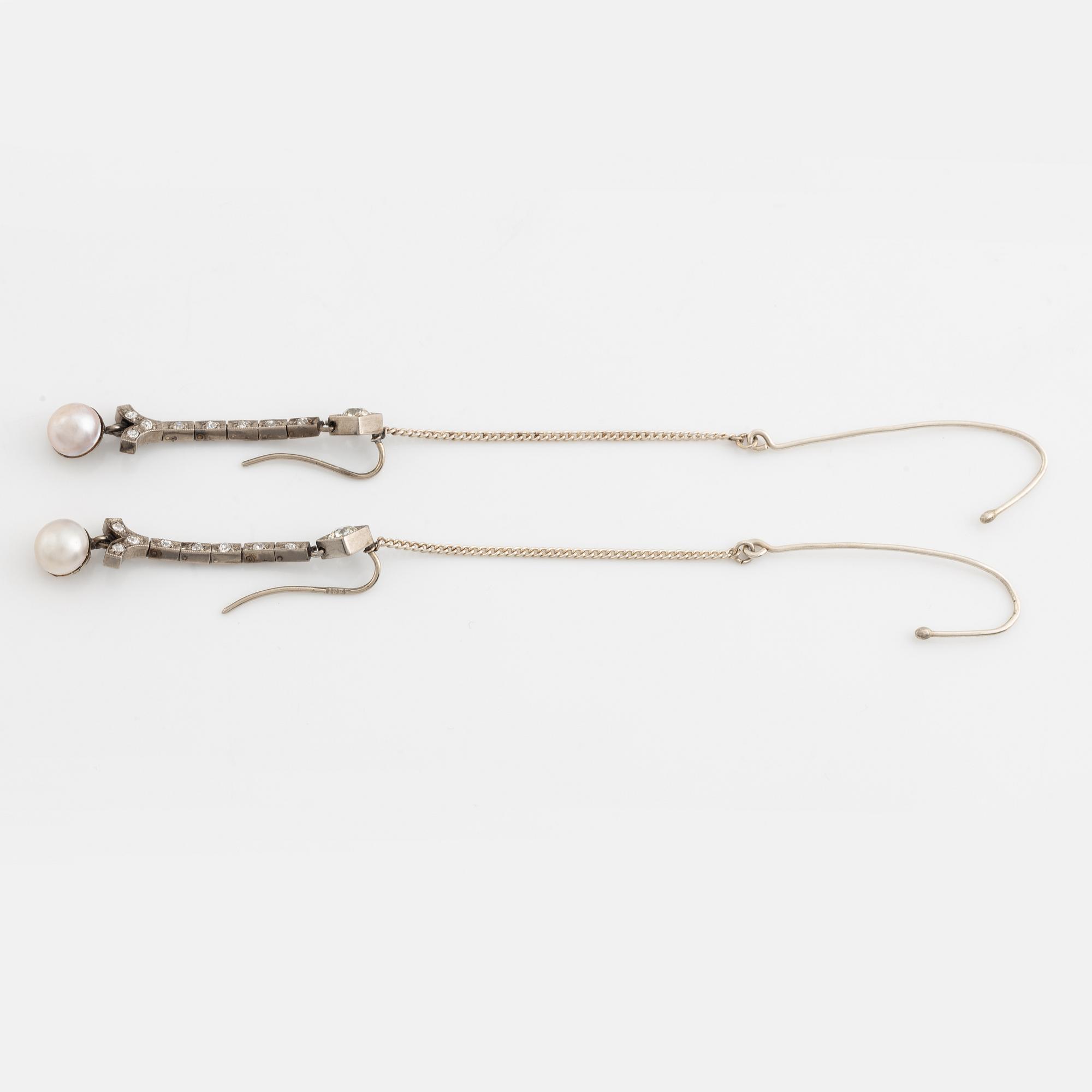 A pair of 18K gold and cultured halfpearl and diamond earrings.