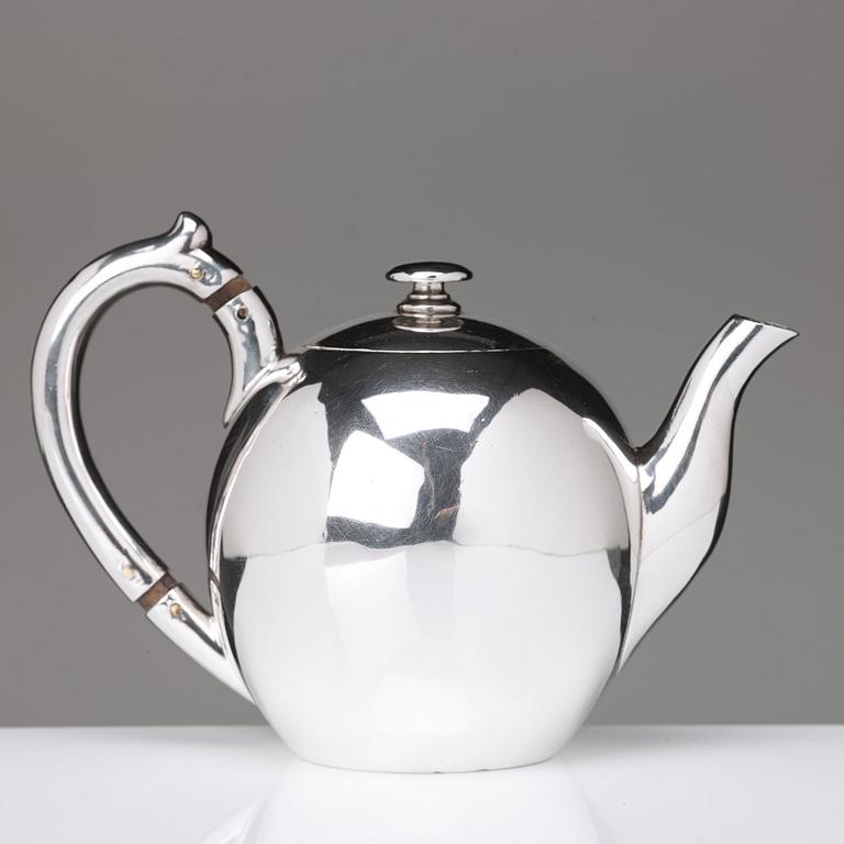 A German 20th century parcel-gilt silver tea-pot, marked Wilkens 875.