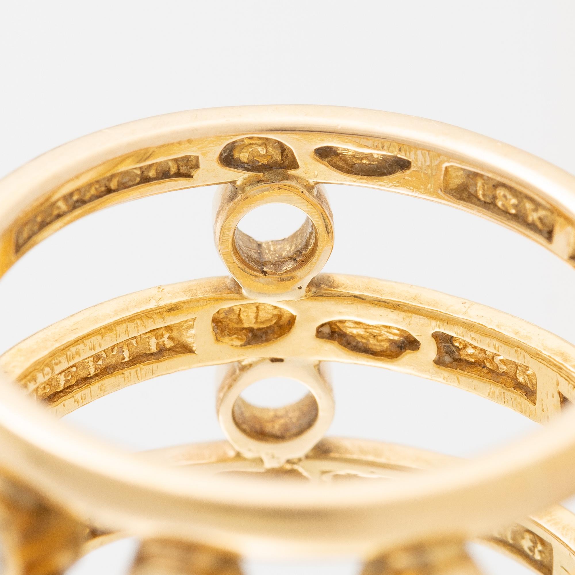 Ring 18K and 23K gold with diamonds in various colours.