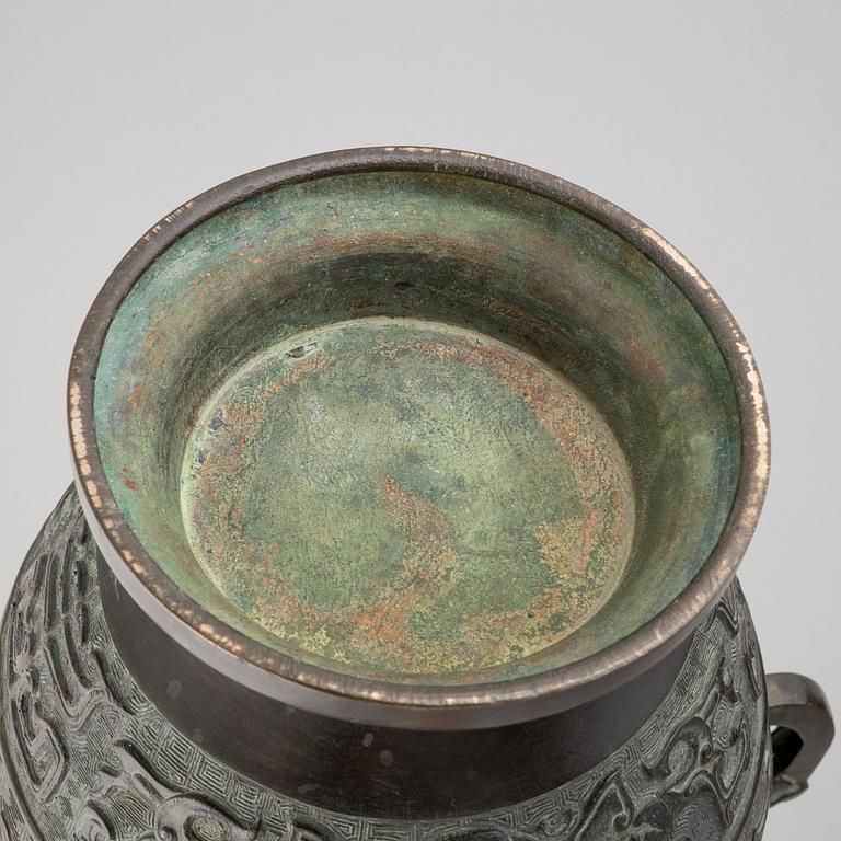 A pair of Chinese bronze urns, 20th century.