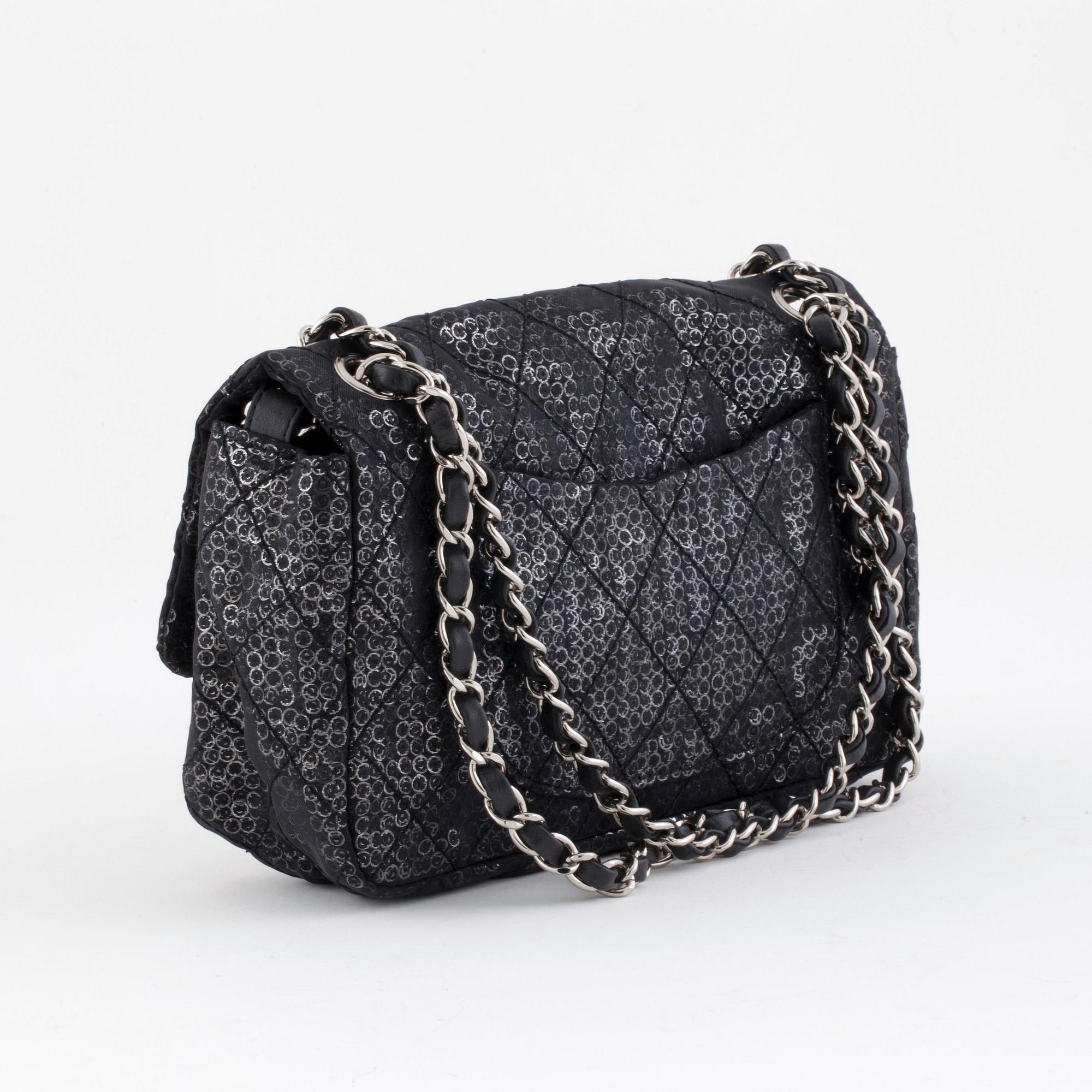 CHANEL, a black and silver tinsel evening "Flap-bag".